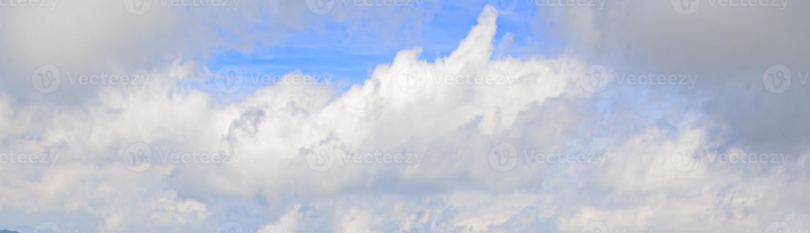 Image of a partly cloudy and partly clear sky during the day photo