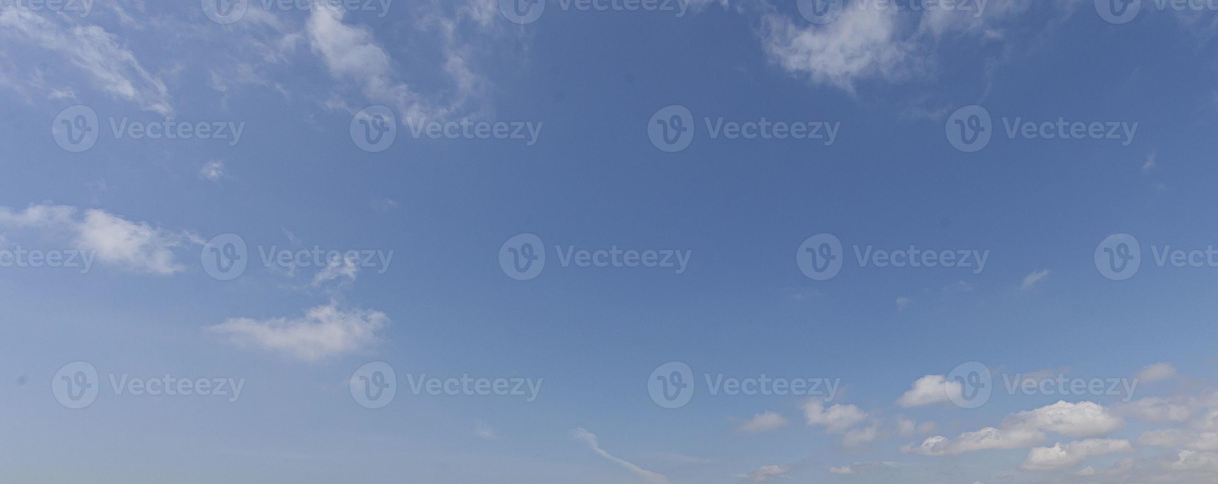 Image of a partly cloudy and partly clear sky during the day photo
