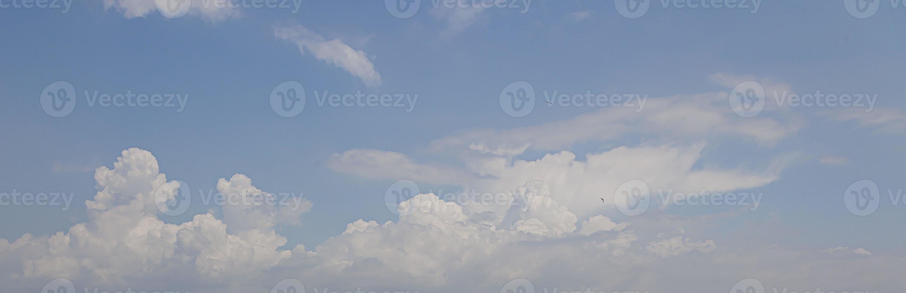 Image of a partly cloudy and partly clear sky during the day photo