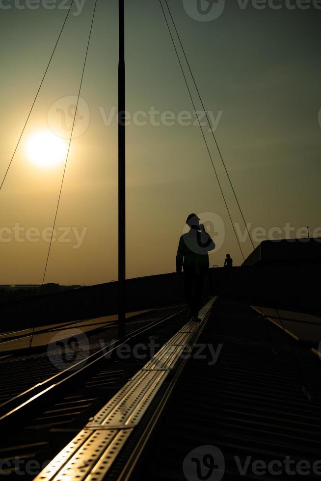 Technicians provide quarterly solar cell maintenance services on the factory roof photo