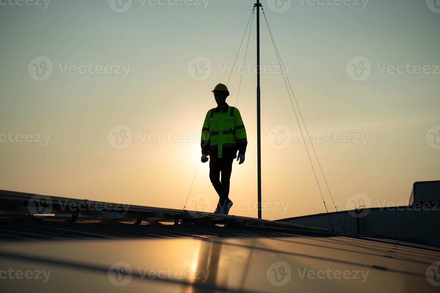 Technicians provide quarterly solar cell maintenance services on the factory roof photo