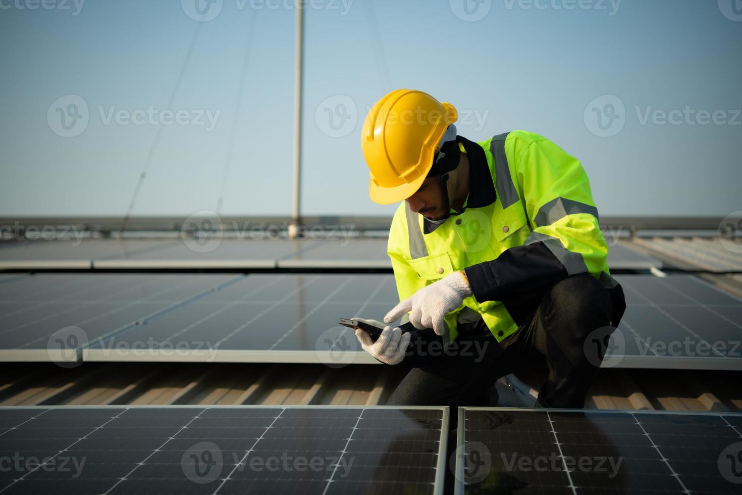 Technicians provide quarterly solar cell maintenance services on the factory roof photo