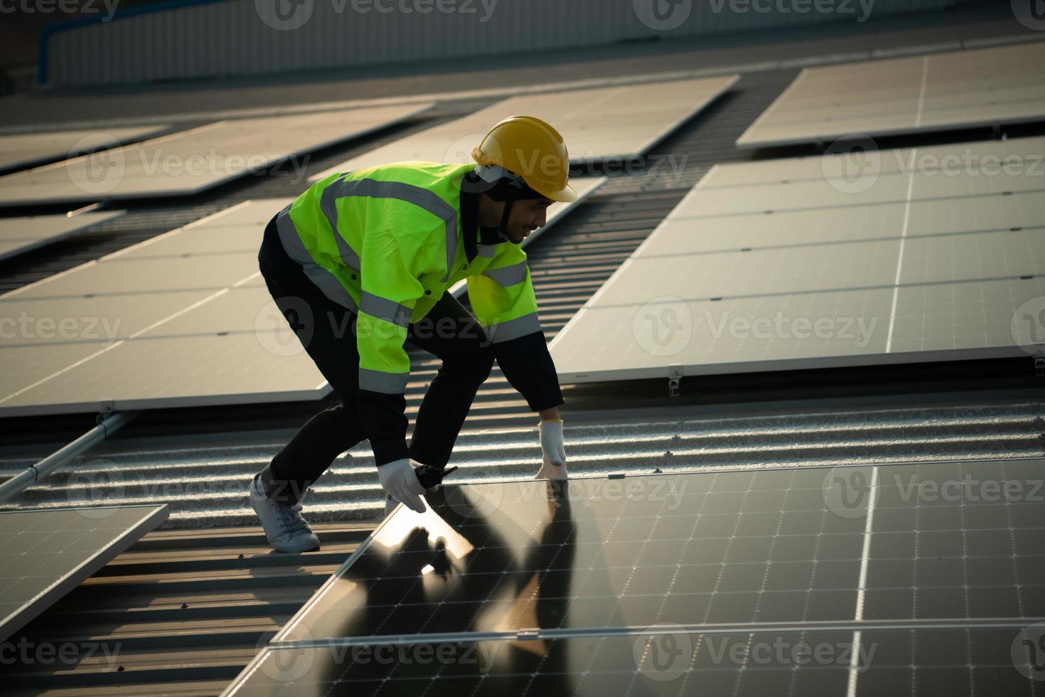 Technicians provide quarterly solar cell maintenance services on the factory roof photo