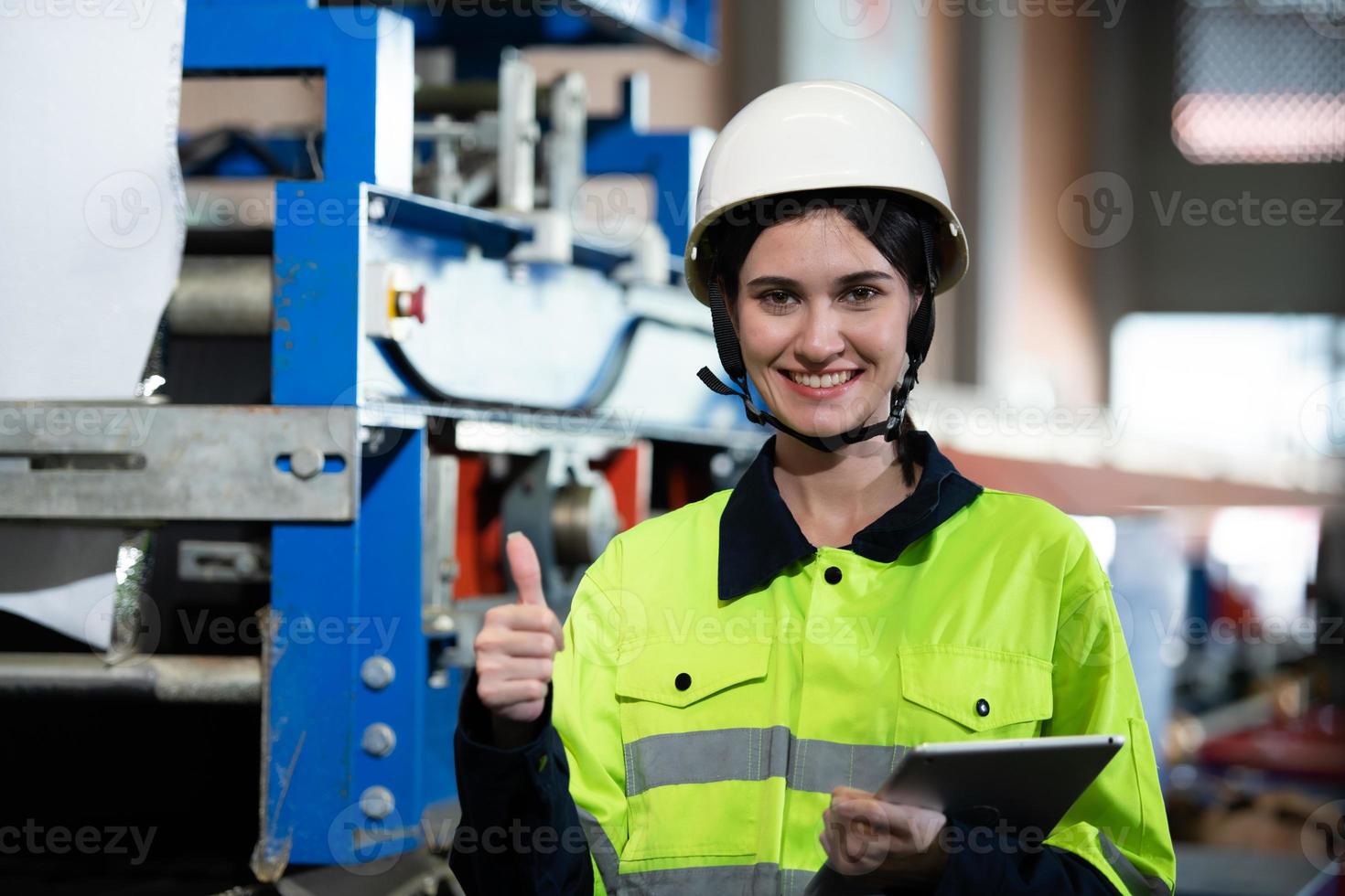 Portrait of a heavy equipment female engineer from a huge industry photo