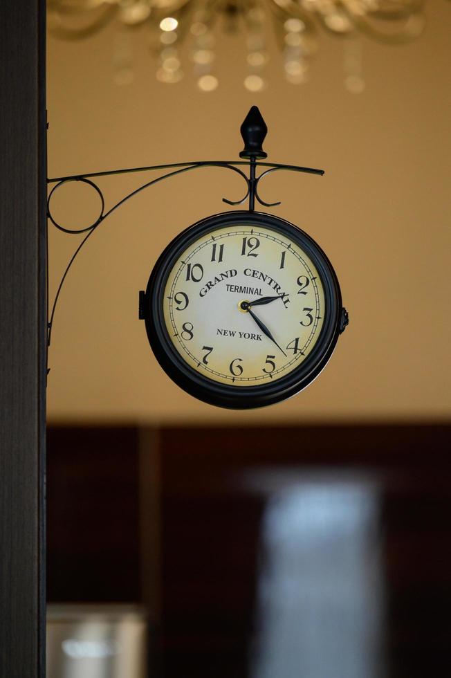 Bukovel, Ukraine February 4, 2022 retro wall clock in the hotel. photo