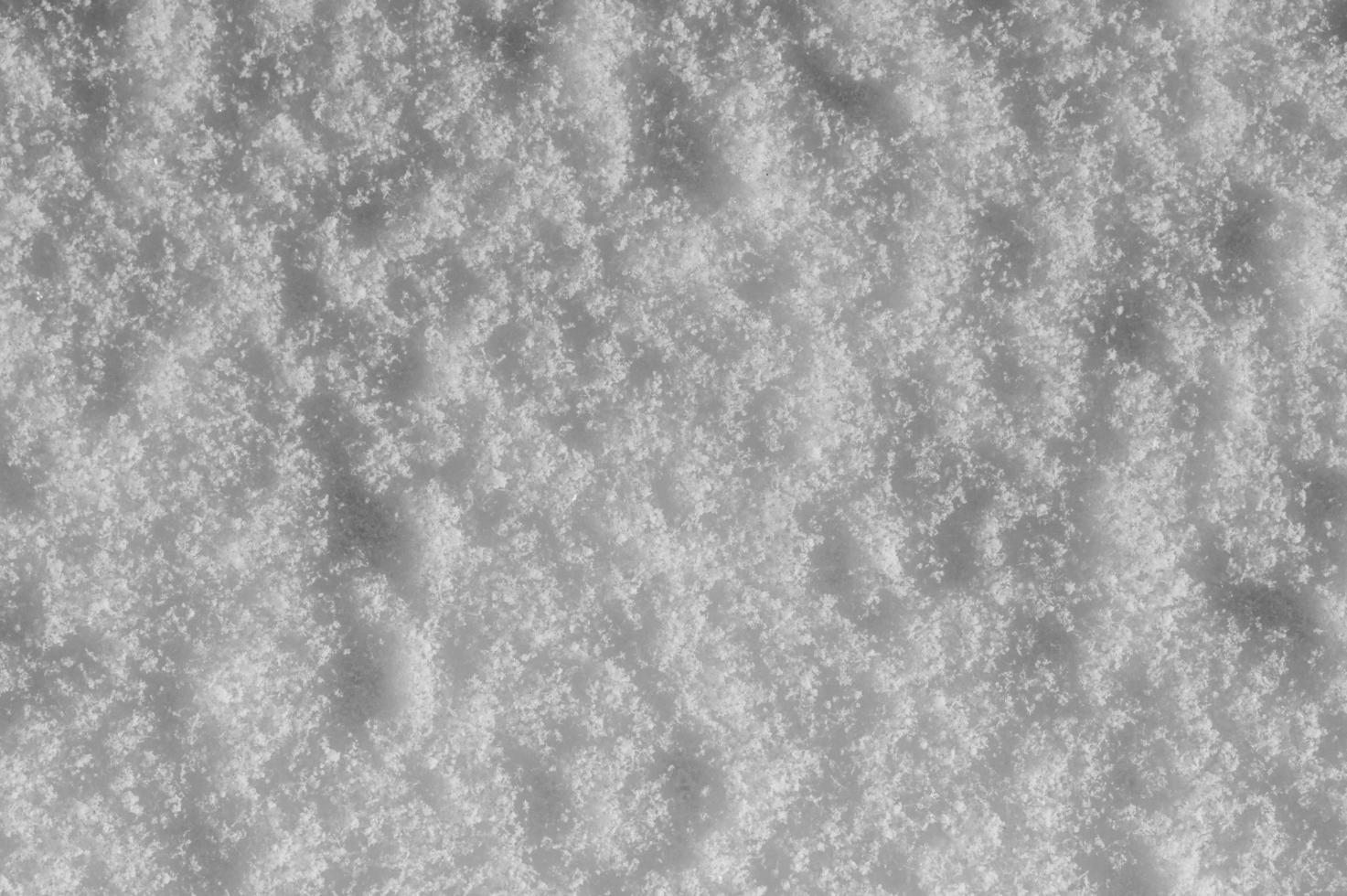 Winter snow background, ice crystals sparkling on snow, christmas texture, sparkling snowflakes in snowdrift. photo