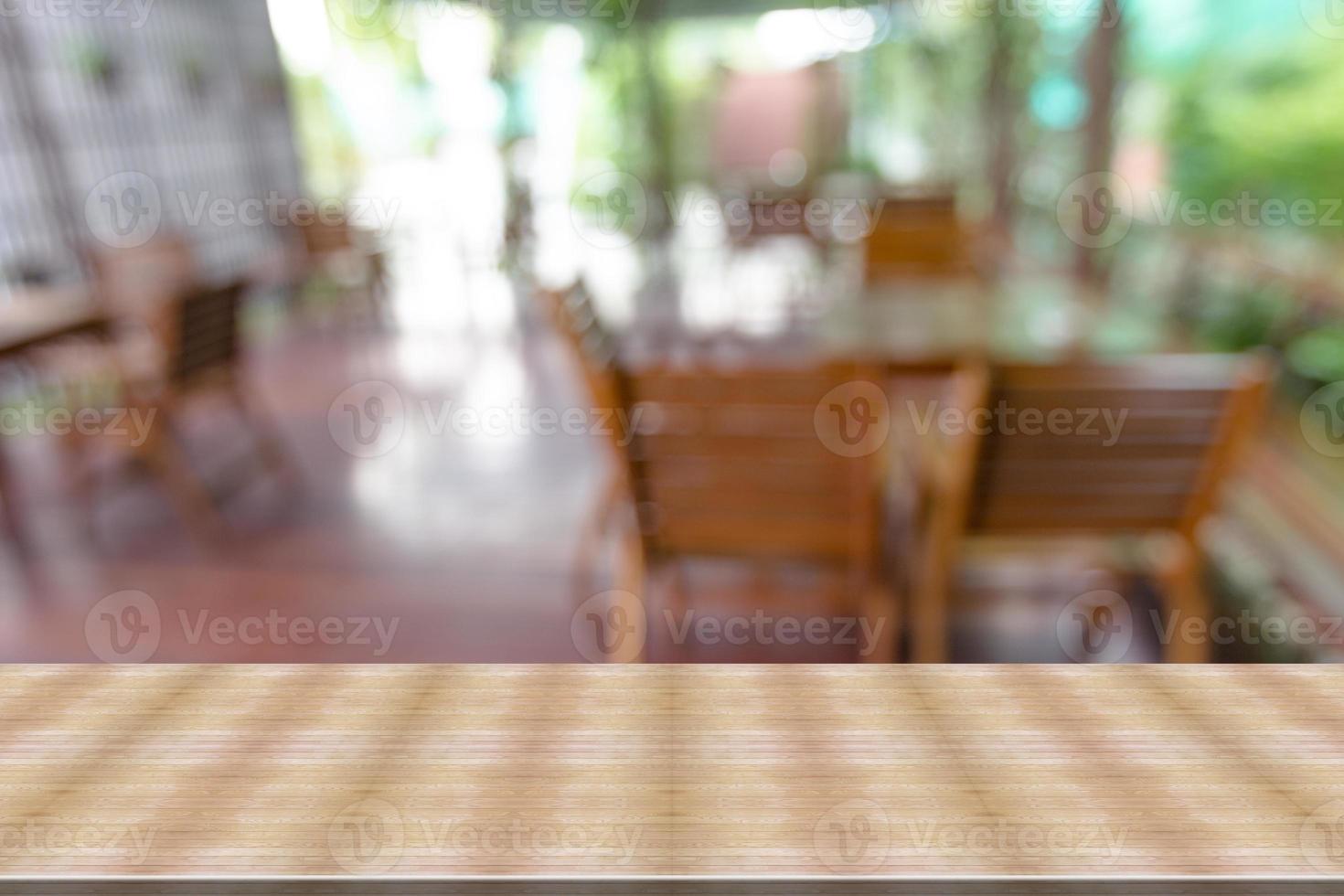 Top desk with blur restaurant background,wooden table photo