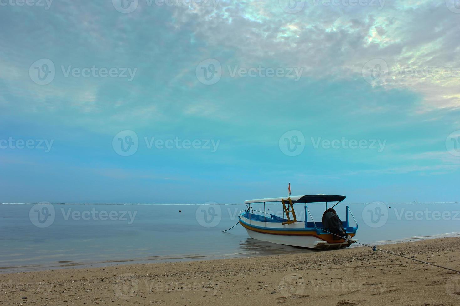 View of a fishing boat on the beach. photo