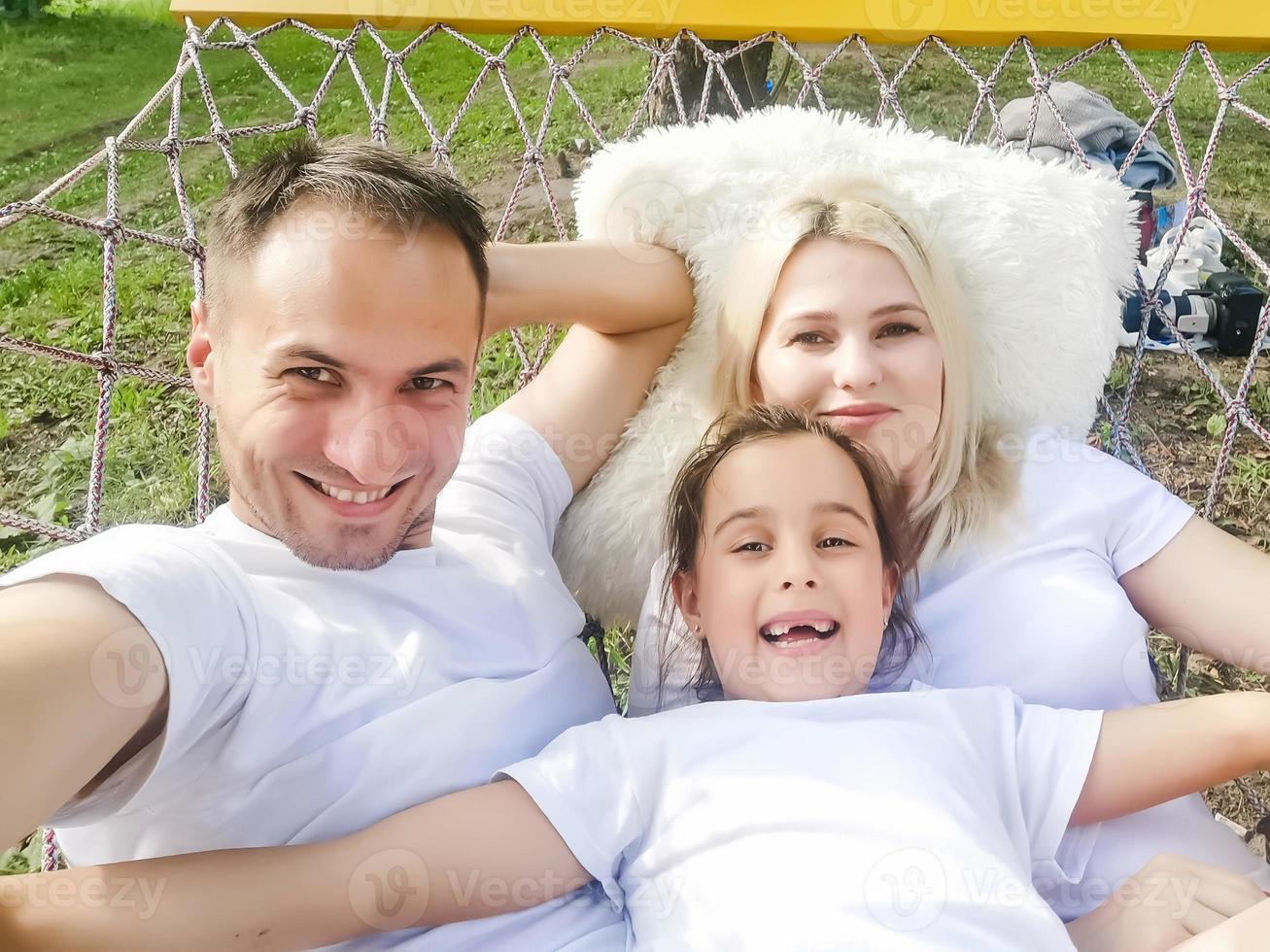 Portrait of family in a hammock photo