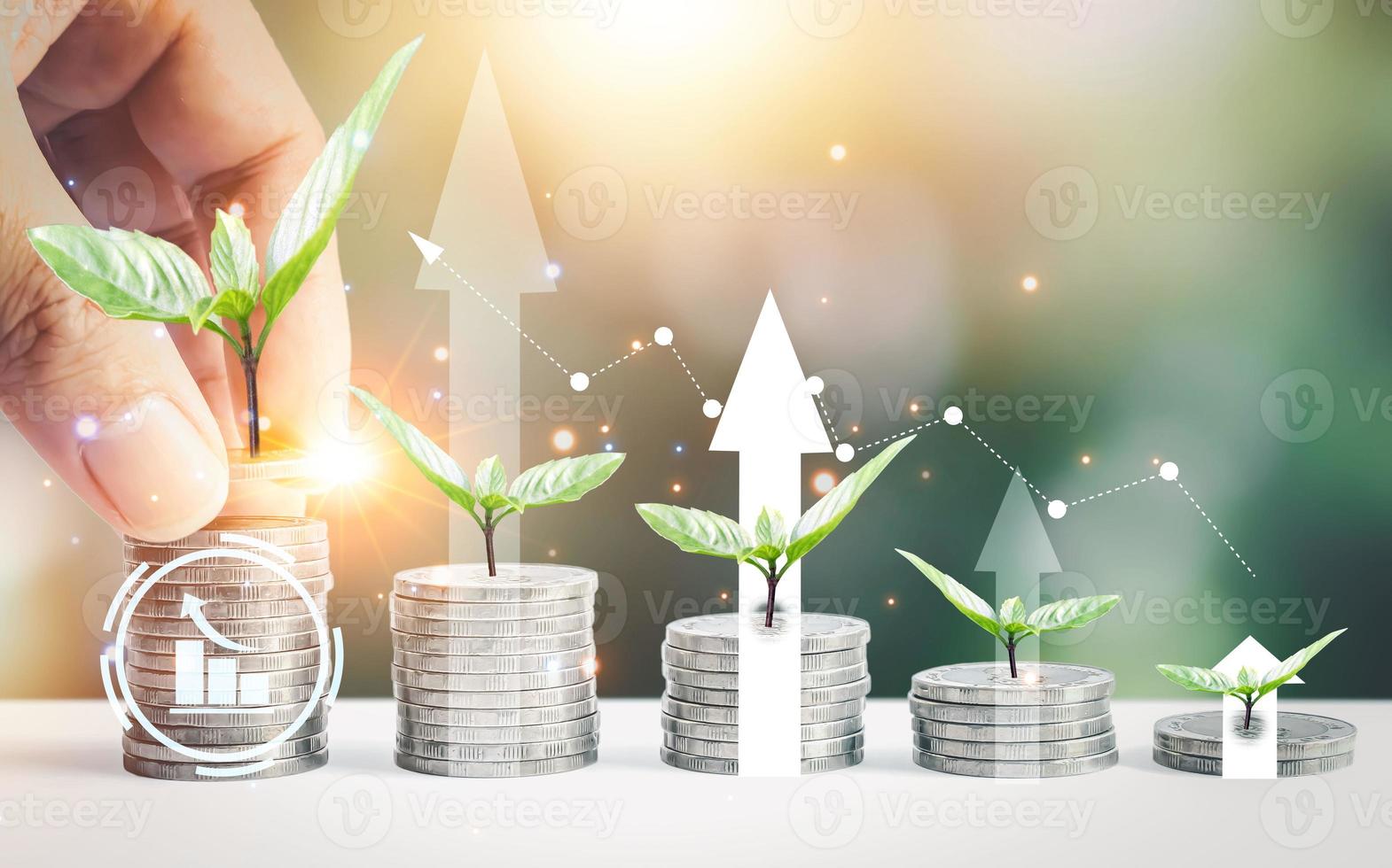 Man hand stacked coins with money saving concept and profit graph business finance in a piggy bank with money boxes for future funds of tourism, home, and retirement on a blurred background. photo