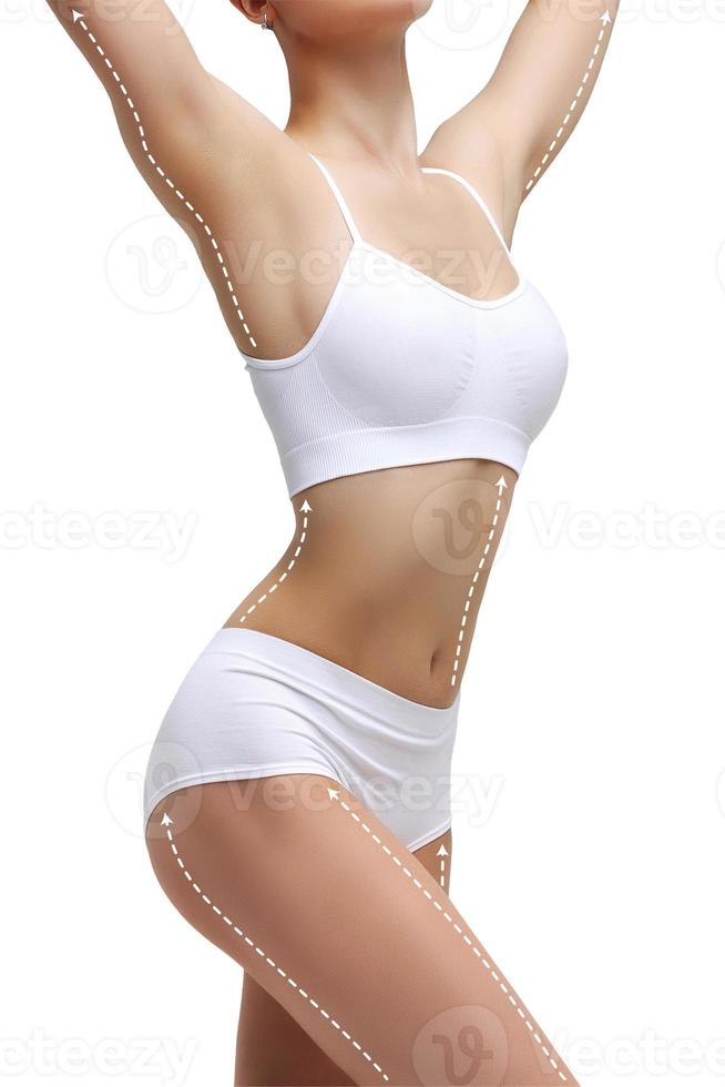 Dotted lines on beautiful female body. Closeup of woman slim fit body with white marks, isolated on white background photo