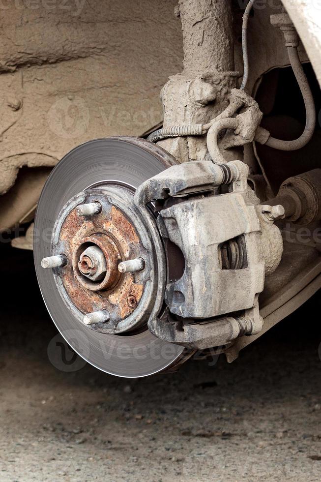 Closeup shot of car's disc brake without wheel on it photo