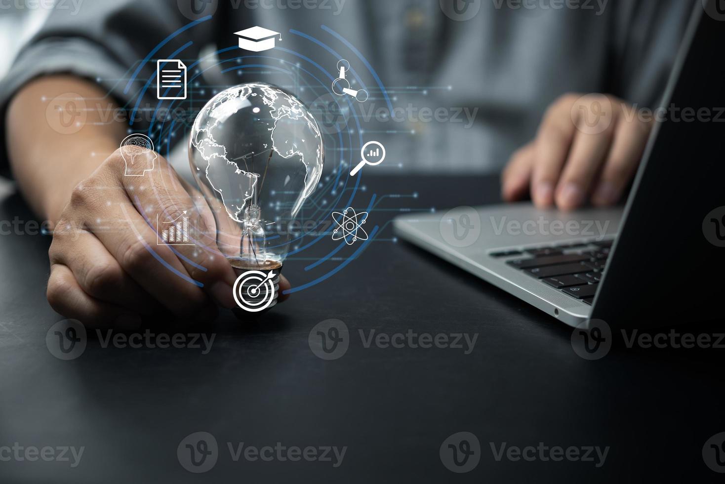 Businessperson or student training skill holding glowing lightbulb with Education learning icons for study knowledge to creative thinking idea and planning or working solution concept. photo