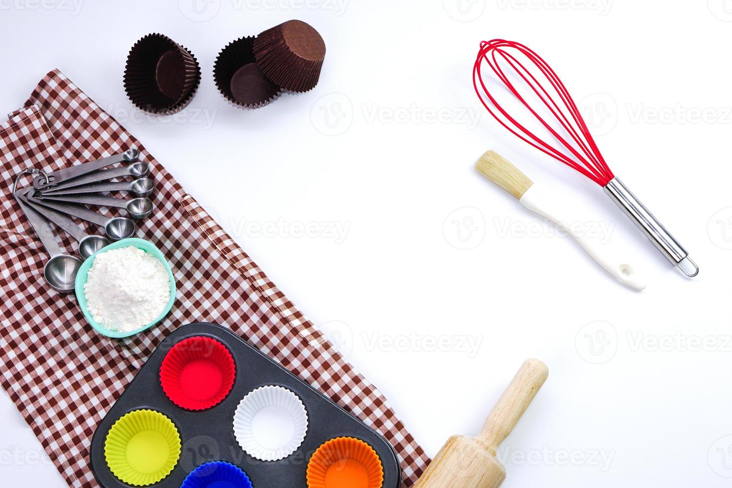 Top view set of kitchen utensils and ingredients for bakery on white background. Materials or kitchen equipment for bakery. photo