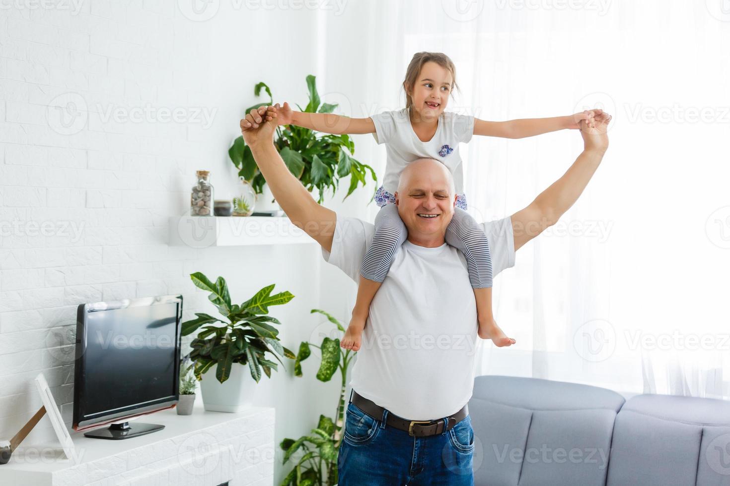 Grandfather meeting his cute granddaughter. photo