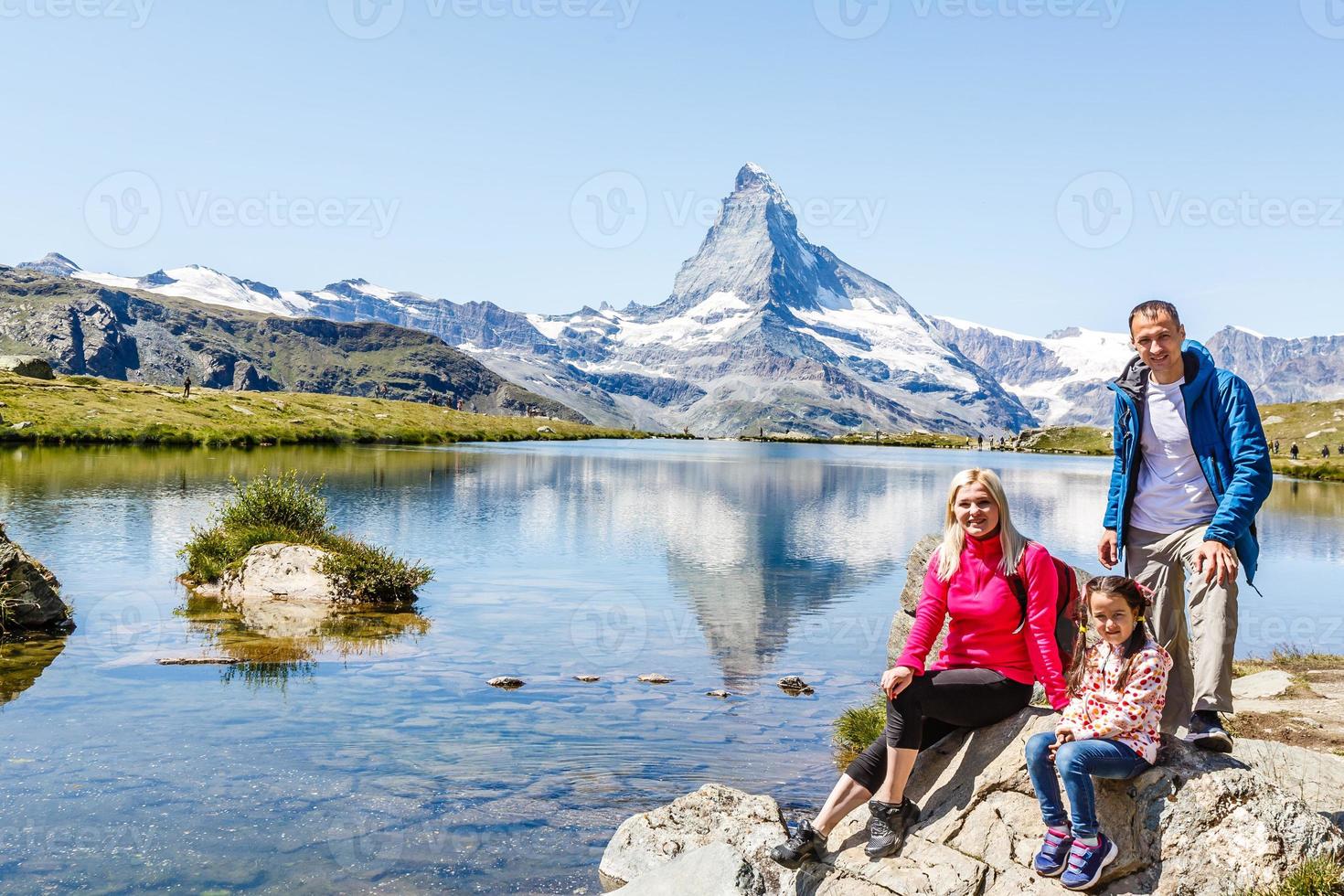 Family on a trekking day in the mountains photo
