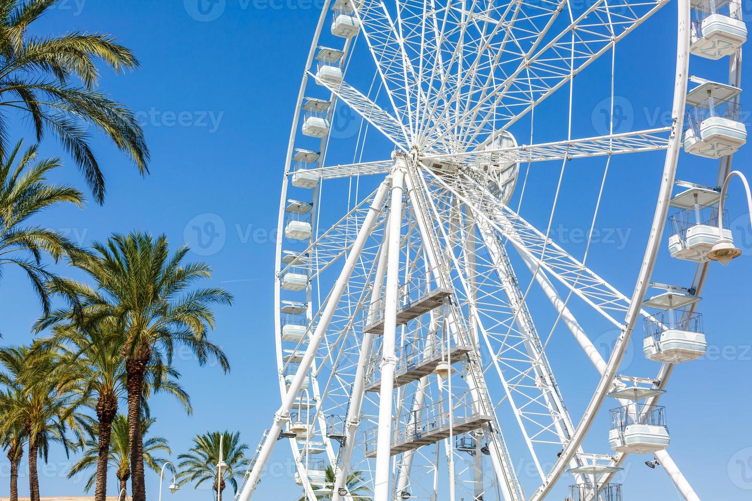 ferris wheel against a blue sky photo