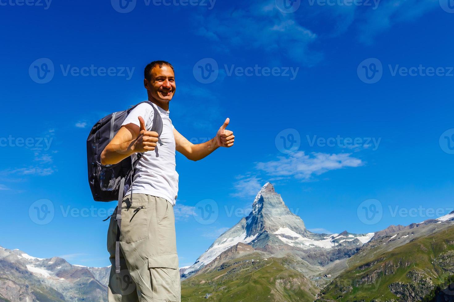 Active family hiking in high alpine region in alps photo