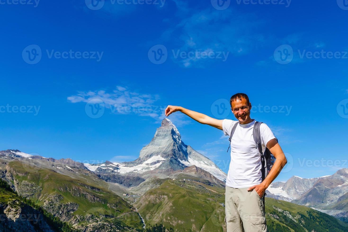 Active family hiking in high alpine region in alps photo