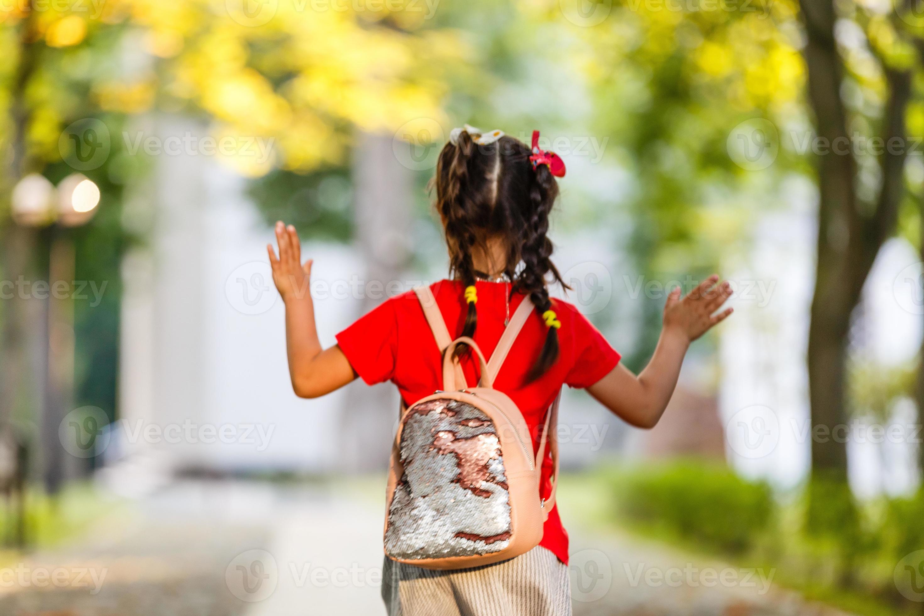 schoolgirl going to school alone 16781003 Stock Photo at Vecteezy