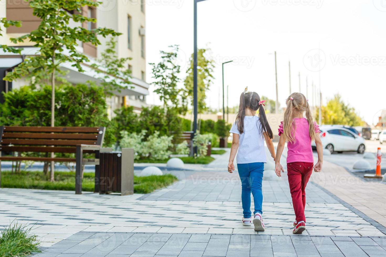 Image of joyful friends having fun on playground outdoors photo