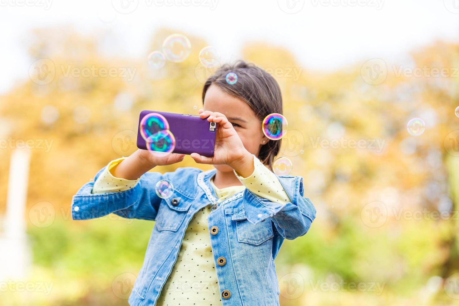 little girl in park in autumn, selfie photo