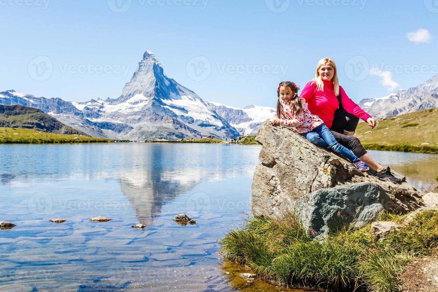 woman looking at the beautiful Mount Matterhorn in the Swiss Alps photo