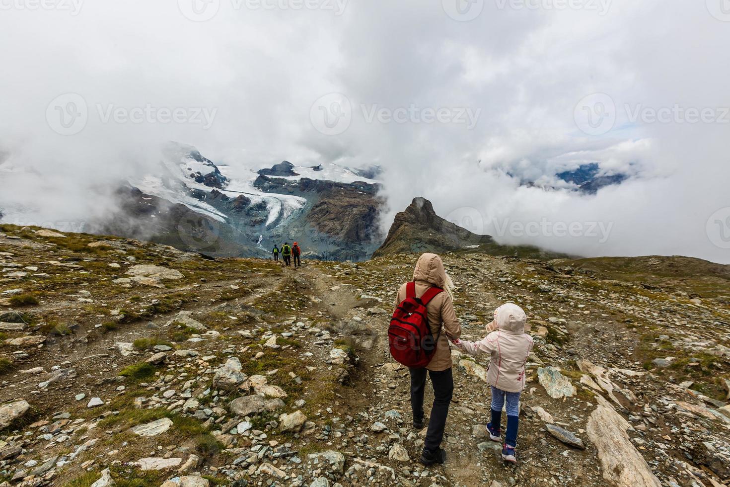 Panorama of stunning mountains and glaciers above, Switzerland. photo