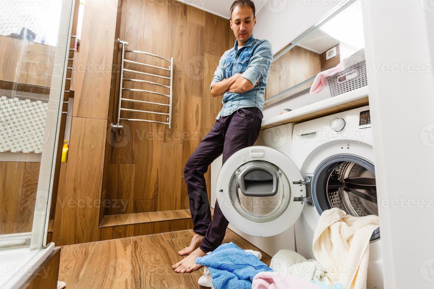 A detail of a male putting in a load of laundry 16781986 Stock Photo at