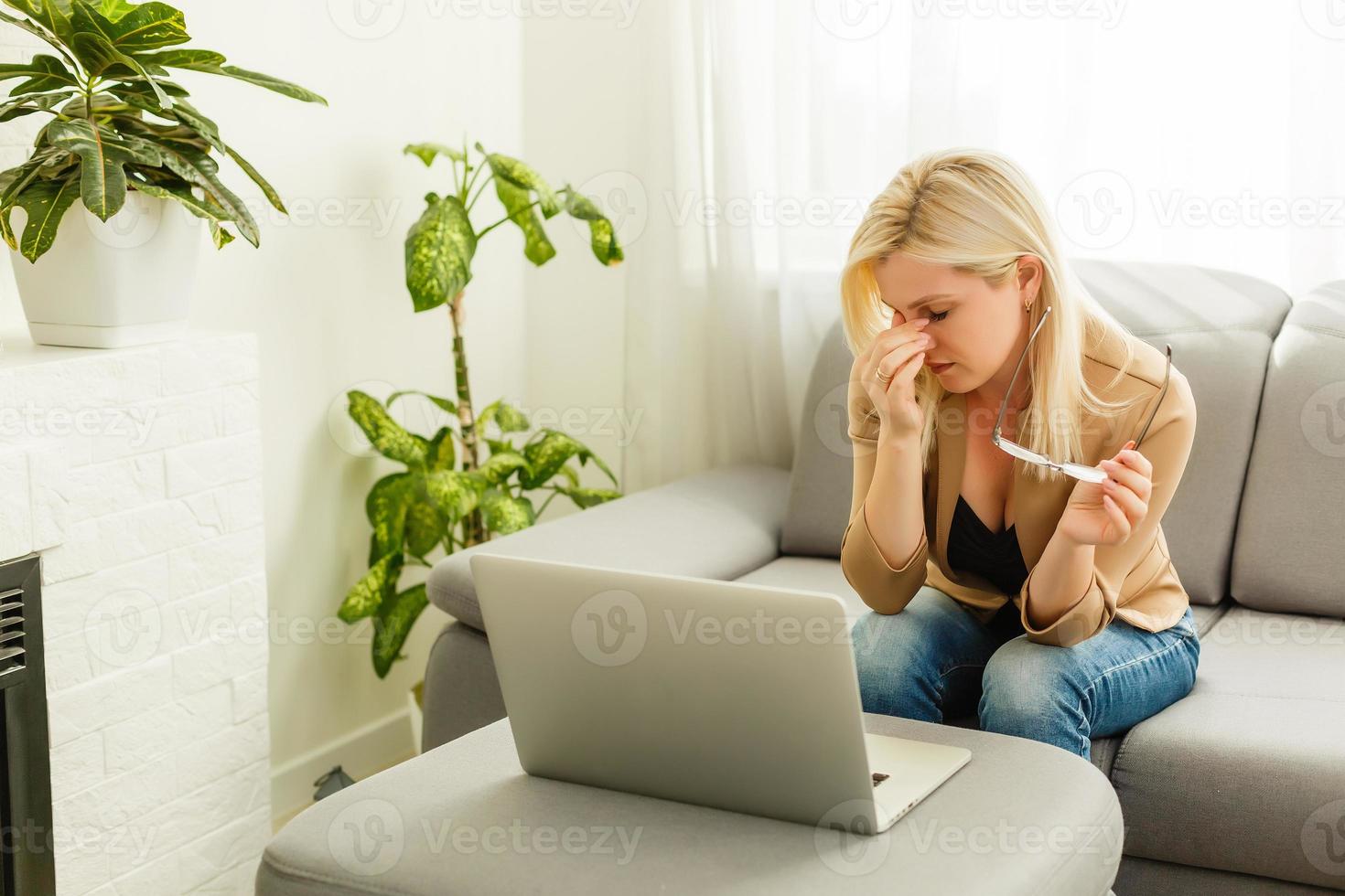 Tired young woman student feeling eye strain bad blurry vision rubbing dry irritated eyes taking off glasses after computer work, fatigued teen girl suffer from discomfort tension problem concept photo