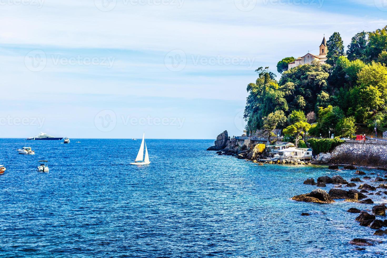 Landscape view of the little city and beach of Camogli in the mediterranean coast of Liguria in Italy photo