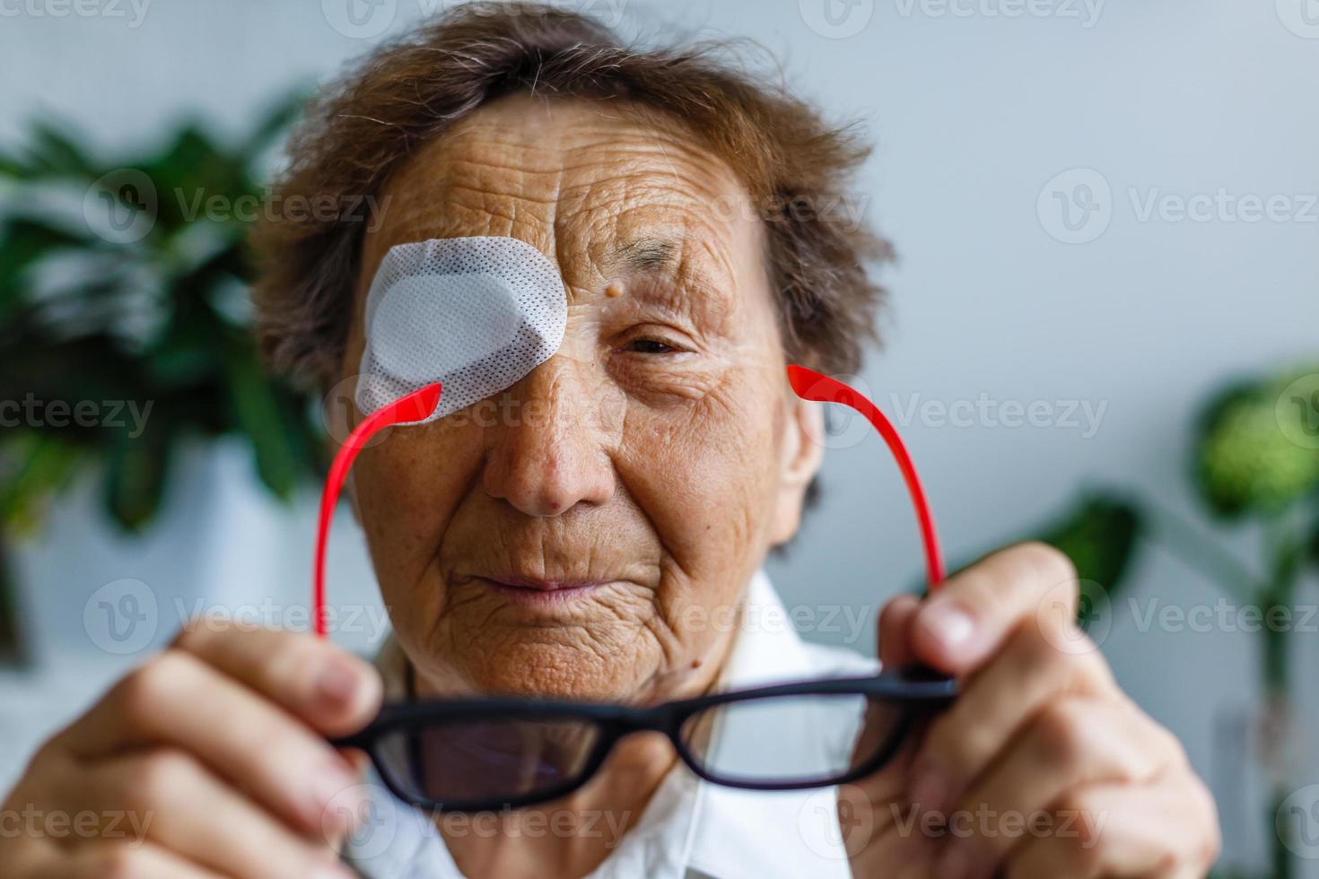 elderly woman with one eye surgery photo