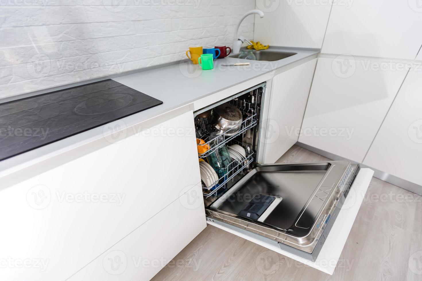 Open dishwasher machine photo