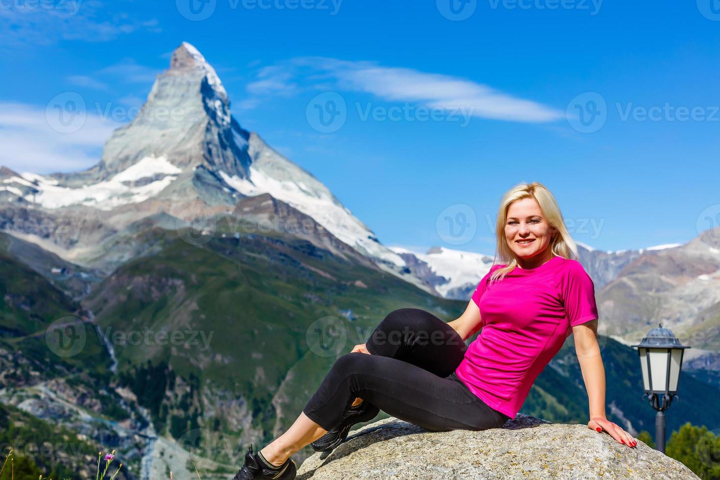 Woman hikers in the Alps, Matterhorn peak in Switzerland photo