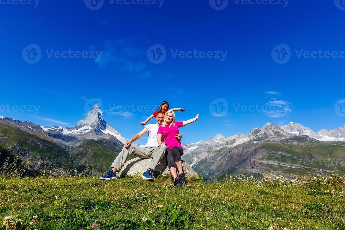 Family on their vacation in mountains photo