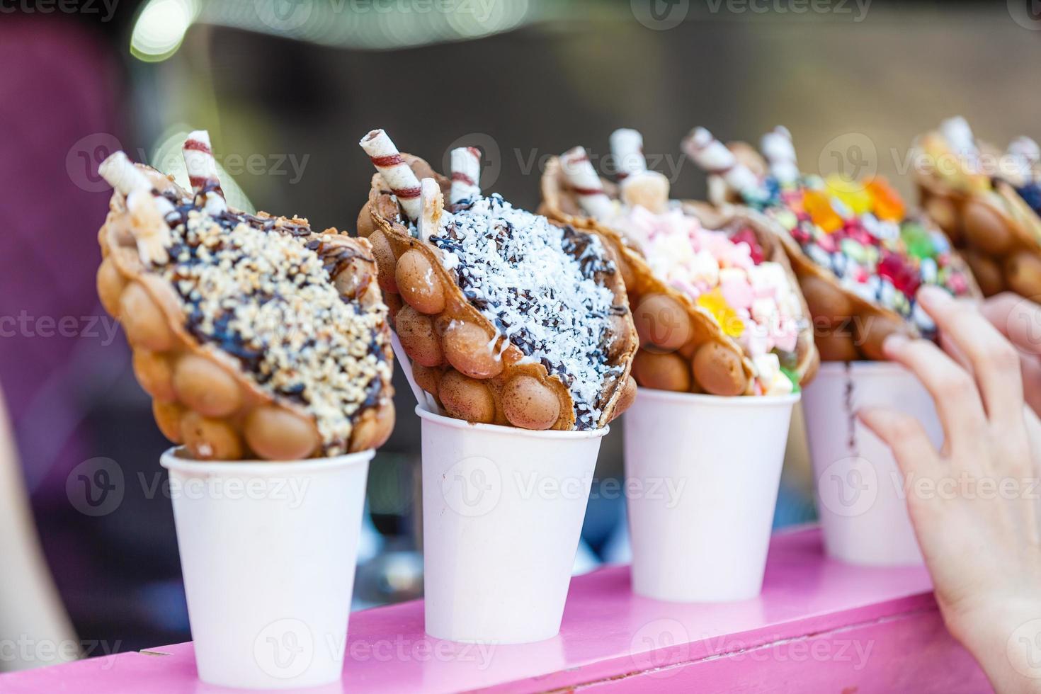 vanilla ice cream bubble waffle with fruit and sweets photo