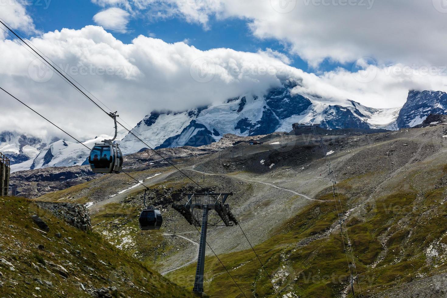 Ski lift mast in a summer mountain landscape at in the Alps photo