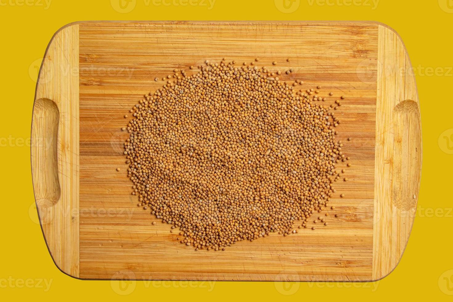 Background of whole mustard seeds. Mustard is widely used in many national cuisines. photo