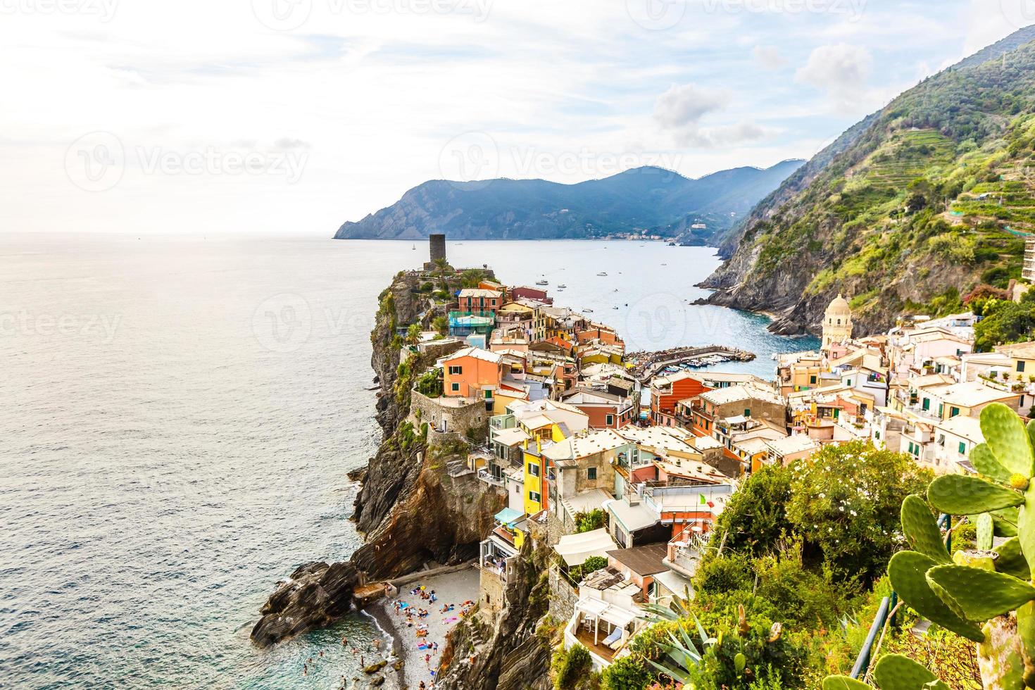 stone beach in italy, looks like a small village by the sea photo