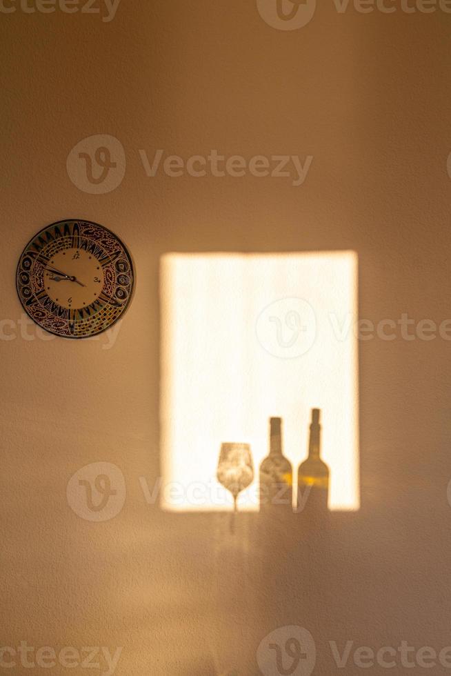 Shadows in the window in the light of the rising sun photo