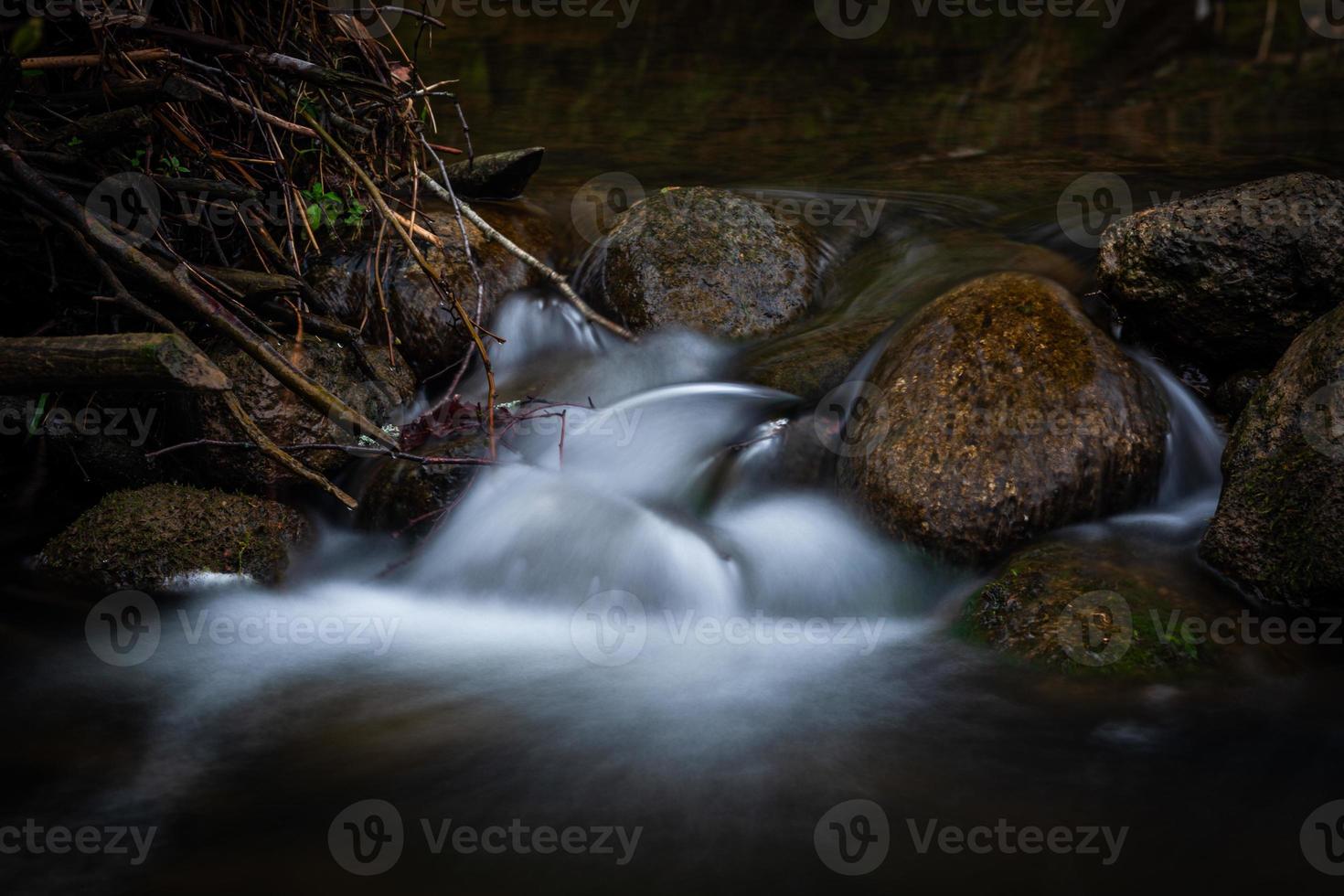 a Small Forest Stream With Sandstone Cliffs and Stones photo