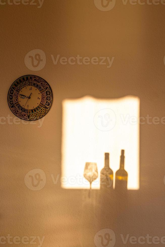 Shadows in the window in the light of the rising sun photo