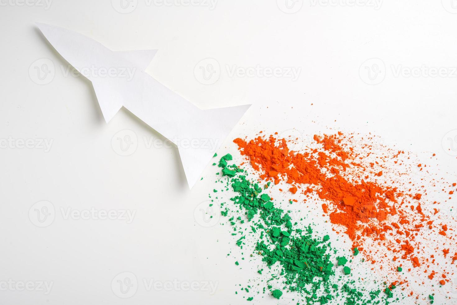 Concept for Indian Independence day and republic day, view of flying missile with tricolor on white background photo