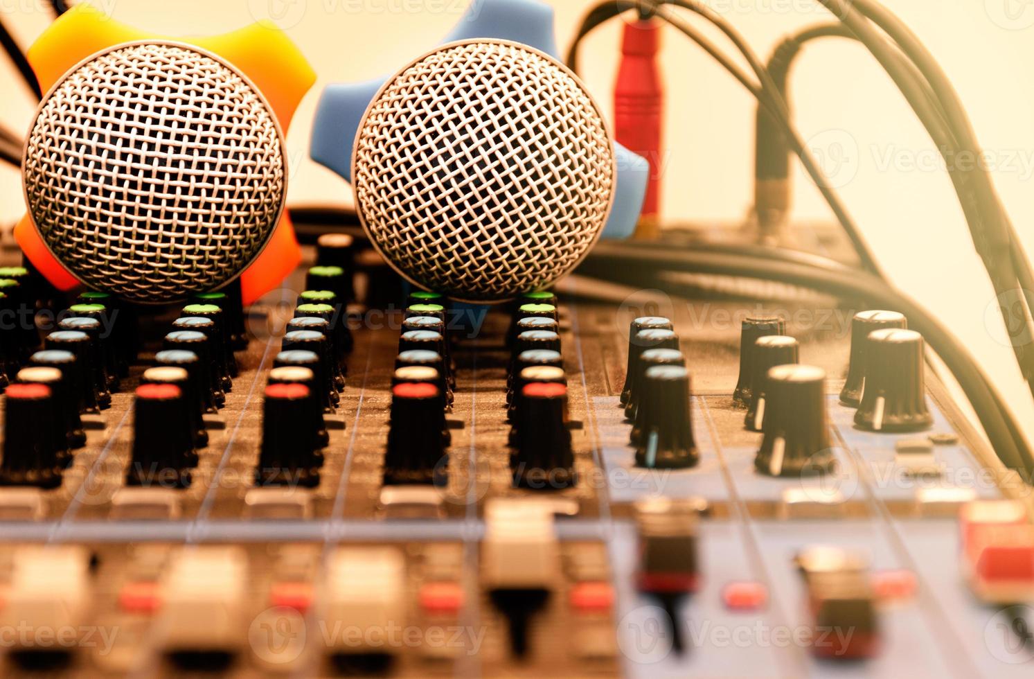 Two microphone on console sound board mixer photo