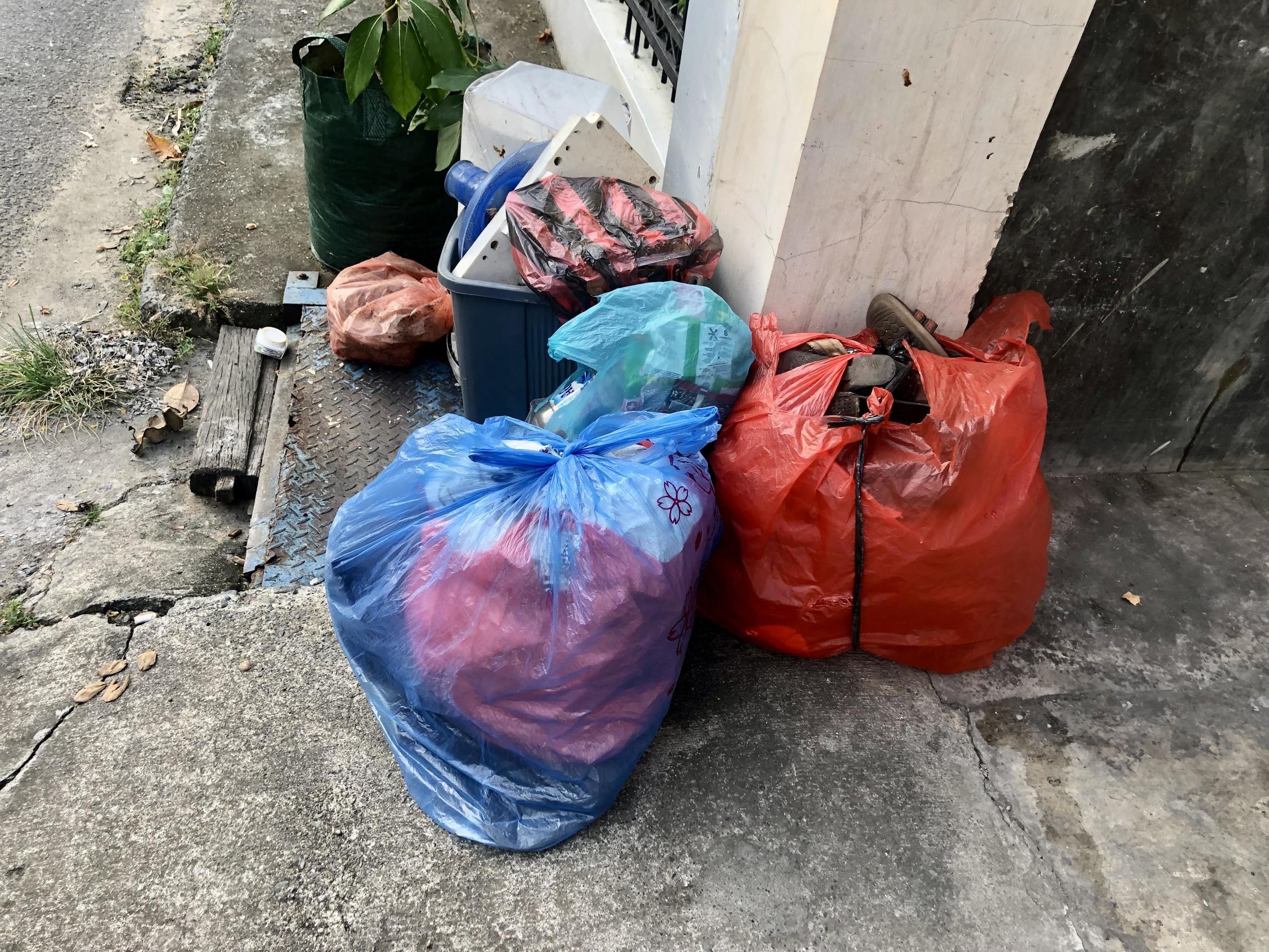 pile of household trash. dirty environment. household waste. trash heap