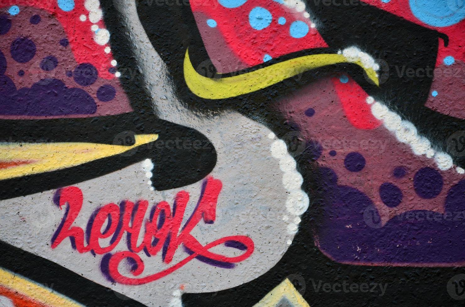 Street art. Colorful graffiti on the wall. Fragment for background. Abstract detail of a graffiti photo