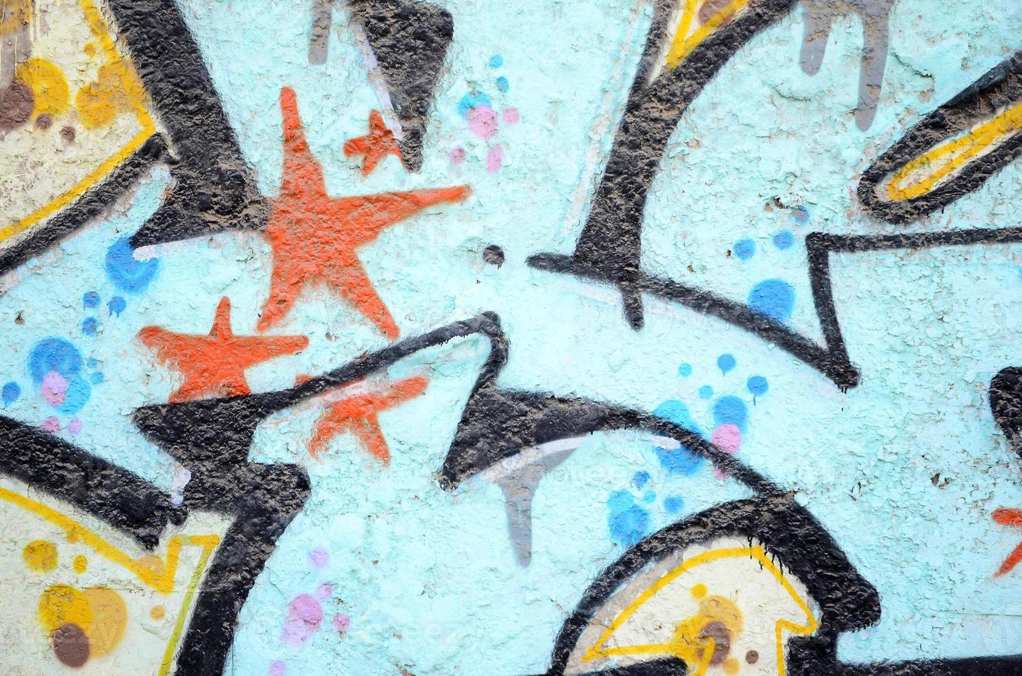 Texture of a fragment of the wall with graffiti painting, which is depicted on it. An image of a piece of graffiti drawing as a photo on street art and graffiti culture topics