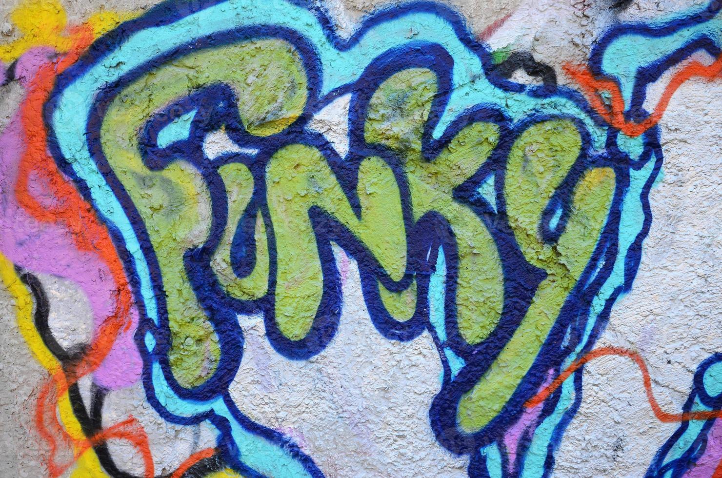 Texture of a fragment of the wall with graffiti painting, which is depicted on it. An image of a piece of graffiti drawing as a photo on street art and graffiti culture topics