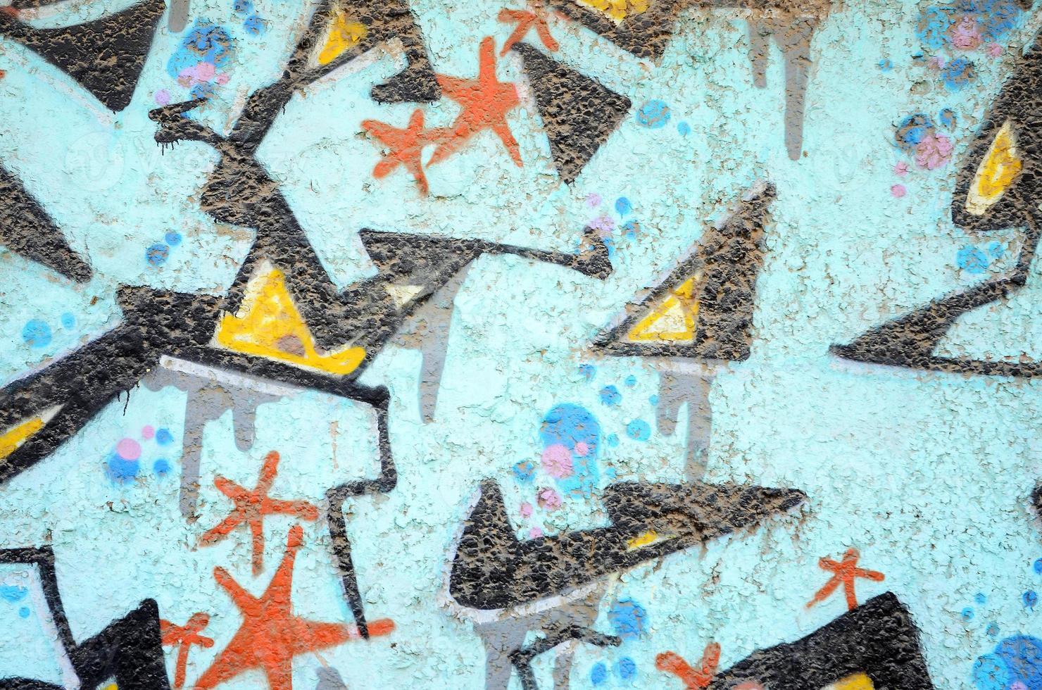 Texture of a fragment of the wall with graffiti painting, which is depicted on it. An image of a piece of graffiti drawing as a photo on street art and graffiti culture topics