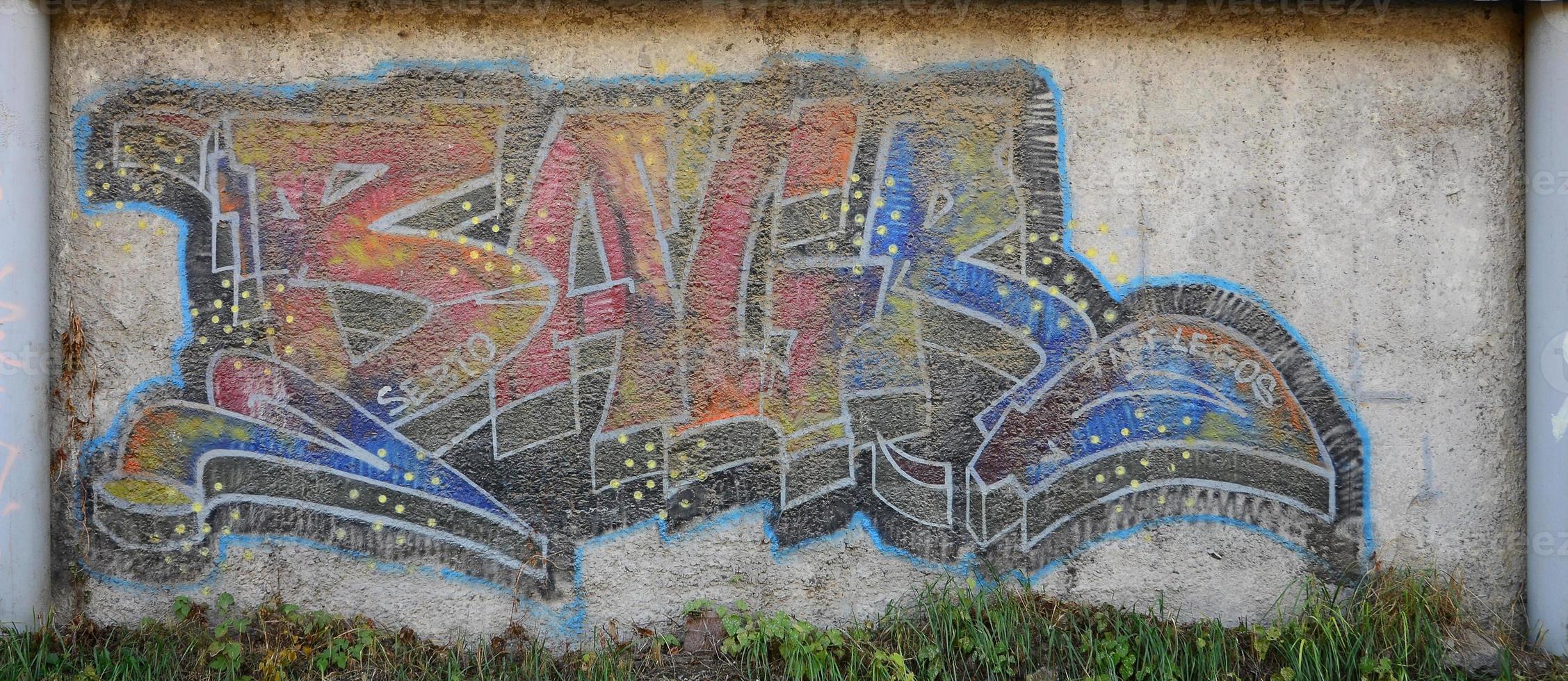 The texture of the wall with graffiti, which is depicted on it. The image of the whole and complete graffiti of the drawing as a resource for the design of 3D projects photo